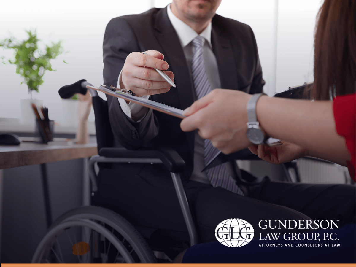 Person sitting in wheelchair checking estate planning papers
