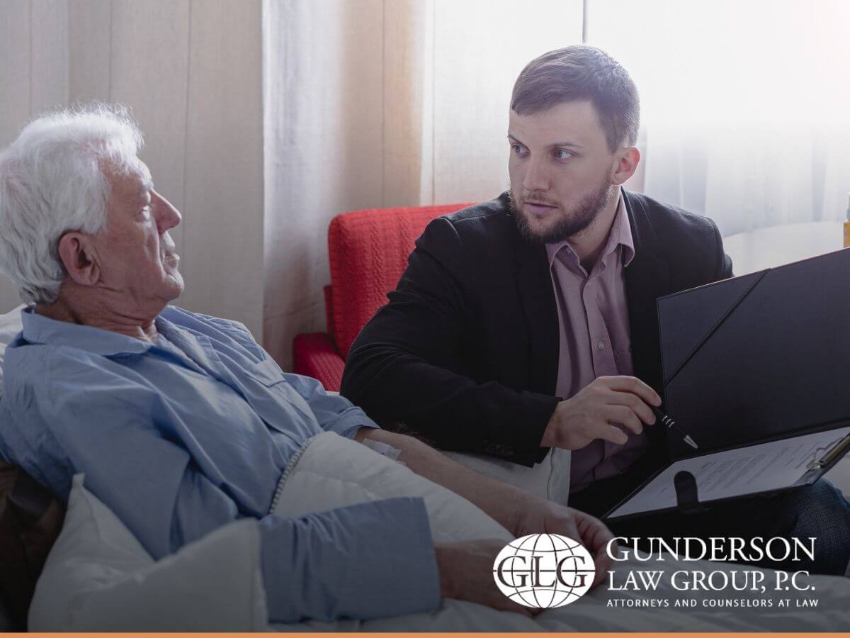 A terminal ill man deciding about his will with his estate planning attorney
