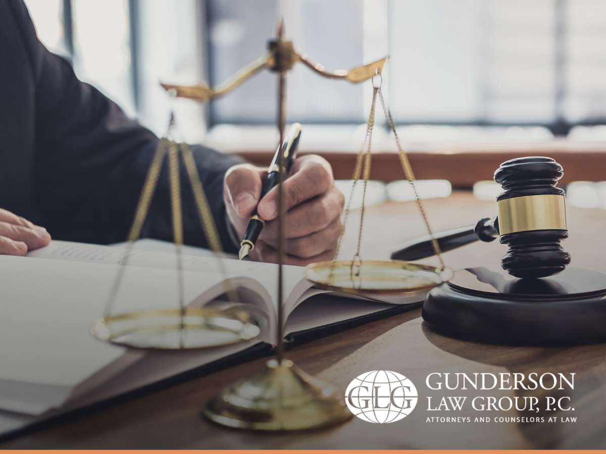 A desk scene with estate planning tools and documents, suggesting the planning process for a 'Trust Fund Kid,' featuring a gavel and scales of justice