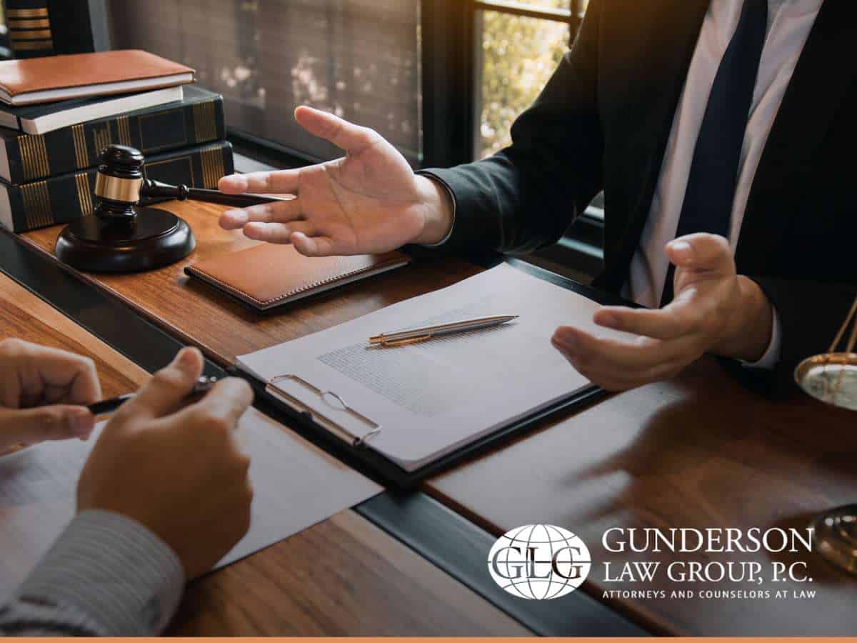 Lawyer discussing estate plan details with a client at a desk