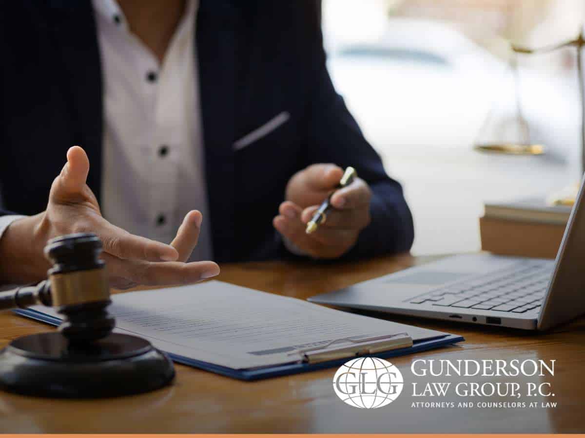 Lawyer discussing documents and legal options at a desk, highlighting strategies for Charitable Giving